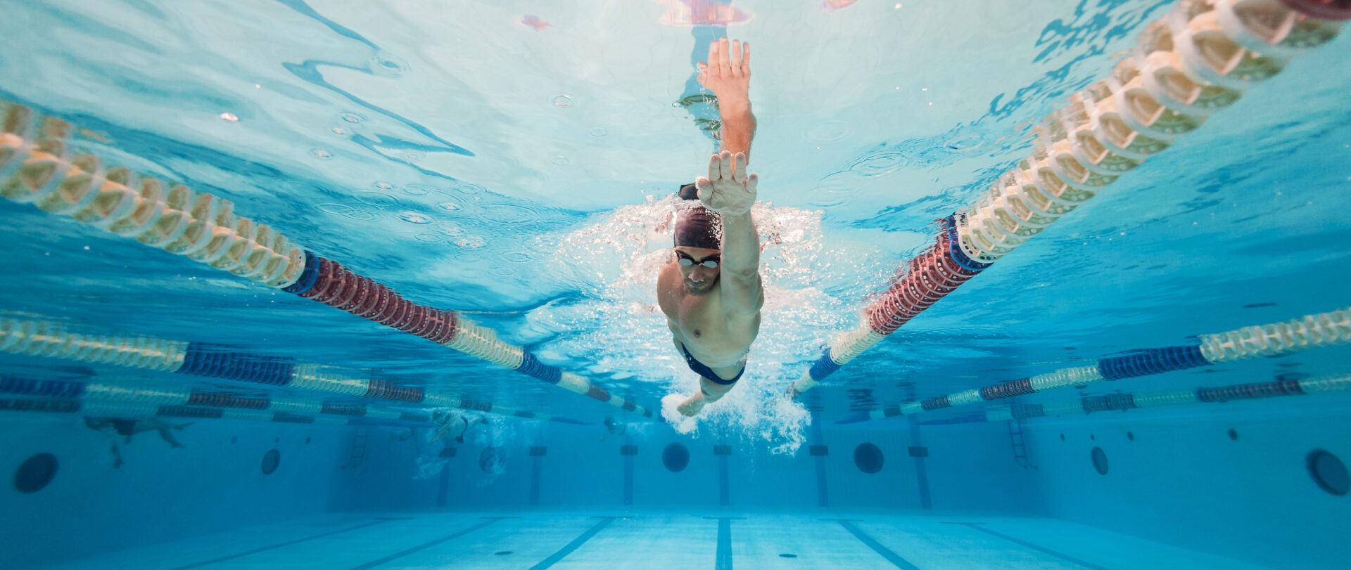 Swimmer underwater in a pool